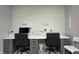 Home office featuring a large workspace, comfortable chairs, and organized decor at 203 Leerkamp Dr, Franklin, IN 46131