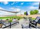 Outdoor patio featuring a lounge area, dining table, and a charming water feature with a view of the field at 203 Leerkamp Dr, Franklin, IN 46131