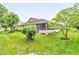 Spacious backyard with mature trees and a screened-in porch, ideal for outdoor enjoyment at 2044 Flamingo Way, Franklin, IN 46131