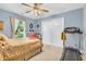 Bedroom features a bed, treadmill, and lots of natural light at 2044 Flamingo Way, Franklin, IN 46131