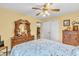 Well-lit bedroom with ceiling fan and hardwood furniture at 2044 Flamingo Way, Franklin, IN 46131