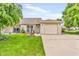Charming brick home with a well-manicured lawn and an inviting front porch perfect for relaxing at 2044 Flamingo Way, Franklin, IN 46131