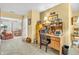 Functional home office setup with a desk, shelving, and an open doorway to the dining area at 2044 Flamingo Way, Franklin, IN 46131