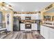 Updated kitchen with white cabinets, modern appliances, and stylish backsplash at 2044 Flamingo Way, Franklin, IN 46131