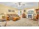 Inviting living room with a decorative fireplace, ceiling fan, and comfortable seating at 2044 Flamingo Way, Franklin, IN 46131