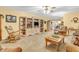Spacious living room featuring neutral-toned walls, plush carpeting, and a decorative entertainment center at 2044 Flamingo Way, Franklin, IN 46131
