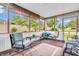 Relaxing sunroom with comfortable seating and views of the landscaped backyard at 2044 Flamingo Way, Franklin, IN 46131