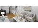 Cozy basement living room with modern furnishings and decor, with stairs and doorways visible at 2046 N Tibbs Ave, Indianapolis, IN 46222