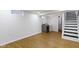 Spacious unfinished basement with stairs, vinyl floors and laundry area with washer and dryer units at 2046 N Tibbs Ave, Indianapolis, IN 46222