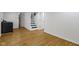 Spacious unfinished basement with stairs, vinyl floors and laundry area with a washer unit at 2046 N Tibbs Ave, Indianapolis, IN 46222