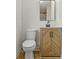 Cozy bathroom featuring modern vanity with stylish wood grain, and a toilet at 2046 N Tibbs Ave, Indianapolis, IN 46222
