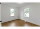 Bedroom featuring laminate floors and natural light from the windows at 2046 N Tibbs Ave, Indianapolis, IN 46222