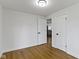 Bedroom featuring modern lighting, laminate floors and two doorways at 2046 N Tibbs Ave, Indianapolis, IN 46222