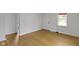 Clean and minimalist bedroom with wood-look flooring and ample natural light at 2046 N Tibbs Ave, Indianapolis, IN 46222