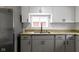 Kitchen features granite countertops, modern cabinetry, and stainless-steel appliances at 2046 N Tibbs Ave, Indianapolis, IN 46222