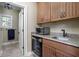 A convenient bar area with a sink, microwave, and beverage cooler enhances the functionality of this home at 24 Shannon Rd, Zionsville, IN 46077