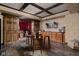 Charming bar area with wooden accents, a barrel table, and seating offers a cozy space for entertaining at 24 Shannon Rd, Zionsville, IN 46077