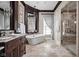 Bright bathroom features soaking tub, walk-in shower, and dual vanity with granite countertops at 24 Shannon Rd, Zionsville, IN 46077
