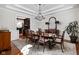 Elegant dining room features detailed molding, hardwood floors, and designer lighting at 24 Shannon Rd, Zionsville, IN 46077