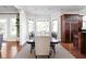 Bright dining room with large windows and updated wood floors and modern accents at 24 Shannon Rd, Zionsville, IN 46077