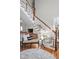 Elegant staircase featuring wood banister and white railings, complemented by stylish decor at 24 Shannon Rd, Zionsville, IN 46077