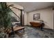 An elegant foyer showcases slate flooring, a wooden staircase, and tasteful decor, creating a welcoming entrance at 24 Shannon Rd, Zionsville, IN 46077
