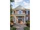 Welcoming front entrance with a covered porch, white columns, and a beautiful front door at 24 Shannon Rd, Zionsville, IN 46077