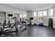 Home gym featuring mirrored wall, rubber flooring, and an array of exercise equipment at 24 Shannon Rd, Zionsville, IN 46077