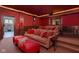 This home theater features tiered seating, soft lighting and warm tones, perfect for movie nights at 24 Shannon Rd, Zionsville, IN 46077