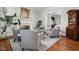 Cozy living room with hardwood floors, a fireplace, and comfortable seating at 24 Shannon Rd, Zionsville, IN 46077
