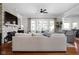 Spacious living room with stone fireplace and French doors leading to the backyard at 24 Shannon Rd, Zionsville, IN 46077