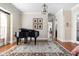 Inviting living room with hardwood floors, neutral walls, and grand piano focal point at 24 Shannon Rd, Zionsville, IN 46077