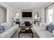 Cozy living room with stone fireplace and two sofas arranged around a coffee table at 24 Shannon Rd, Zionsville, IN 46077