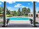 Beautiful in-ground swimming pool with an integrated hot tub and ample lounging space, framed by lush landscaping at 24 Shannon Rd, Zionsville, IN 46077