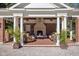 Charming pool house featuring an outdoor fireplace and comfortable seating at 24 Shannon Rd, Zionsville, IN 46077