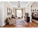 Sitting room offers hardwood floors, chandelier, and sunny window at 24 Shannon Rd, Zionsville, IN 46077