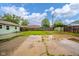 Large backyard features a grass lawn and concrete patio area with ample space at 2726 Apache Dr, Anderson, IN 46012