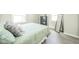 Inviting bedroom featuring a comfortable bed, accent mirror, and tranquil ambiance at 2726 Apache Dr, Anderson, IN 46012