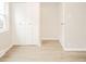 Open bedroom view featuring light, wood-look flooring and an exterior-facing window at 2726 Apache Dr, Anderson, IN 46012