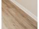 Close up of neutral colored flooring with matching base trim on the walls at 2726 Apache Dr, Anderson, IN 46012