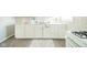 Modern kitchen with white cabinetry, stainless steel sink, and updated countertops at 2726 Apache Dr, Anderson, IN 46012