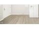 Clean kitchen featuring white appliances, neutral paint, and new flooring at 2726 Apache Dr, Anderson, IN 46012