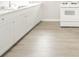 Bright kitchen with white cabinets, countertops, and modern flooring at 2726 Apache Dr, Anderson, IN 46012