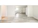 Bright kitchen featuring white appliances, countertop, and new flooring at 2726 Apache Dr, Anderson, IN 46012