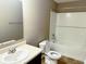 Bathroom featuring tub/shower combo with white subway tile and a single sink vanity at 276 Rocky Rd, Greenfield, IN 46140