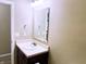 Bathroom featuring a vanity with a sink, mirror, and modern lighting fixture at 276 Rocky Rd, Greenfield, IN 46140