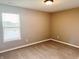 Cozy bedroom featuring plush carpeting, a window providing natural light, and neutral paint at 276 Rocky Rd, Greenfield, IN 46140
