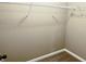 Walk-in closet with a wire shelving system and neutral carpet flooring at 276 Rocky Rd, Greenfield, IN 46140