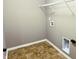 Practical laundry room with tiled floor and washer/dryer hookups at 276 Rocky Rd, Greenfield, IN 46140