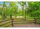 Scenic backyard view with comfortable red Adirondack chairs by a peaceful river at 2781 E Vandalia Rd, Flat Rock, IN 47234